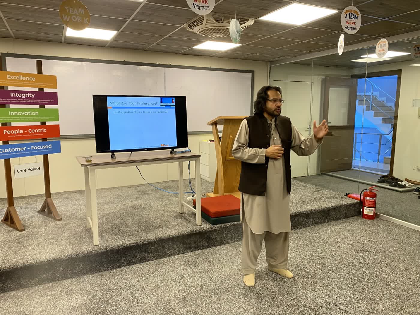 Prof. Dr. Abdul Baseer Qazi running a training session in an organisation